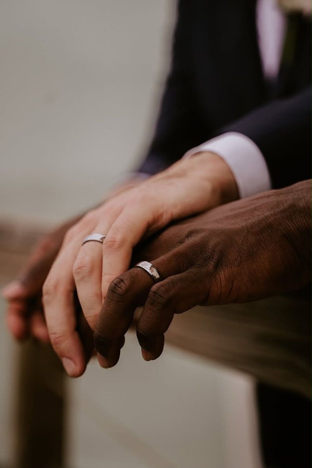 Couple's hands with wedding rings